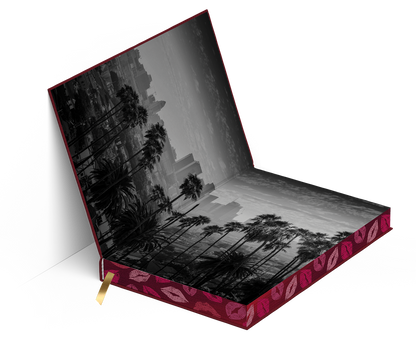 Mockup of the “About That Kiss” special edition showing the inside endpapers with a black-and-white city and palm tree photo spread.