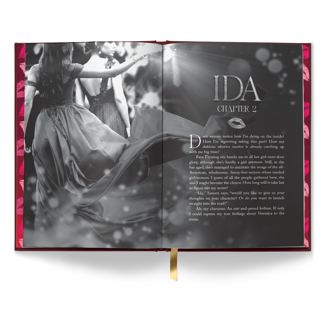 Open-book interior mockup for “About That Kiss” showing a black-and-white chapter header spread titled “IDA, Chapter 2” with a photo-style image of two women in dresses.