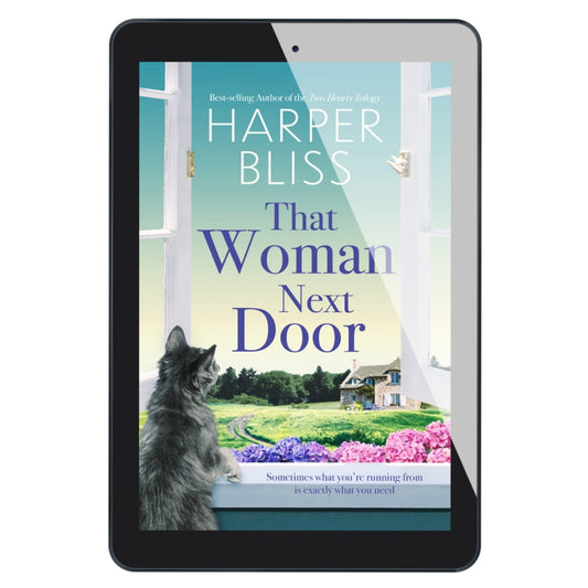 Tablet displaying the book cover of 'That Woman Next Door' by Harper Bliss with a cat looking out a window.